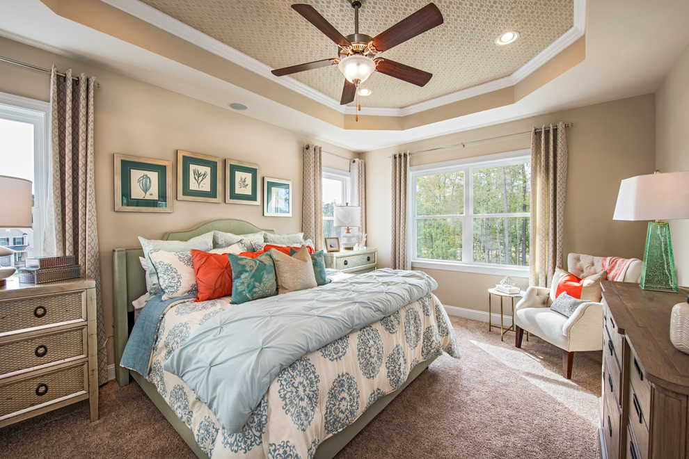Design ideas for a large coastal master bedroom in Raleigh with beige walls, carpet and no fireplace.