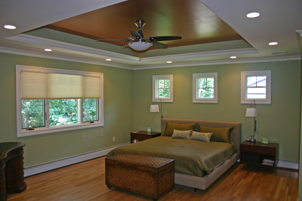 Inspiration for a transitional master bedroom remodel in New York with green walls