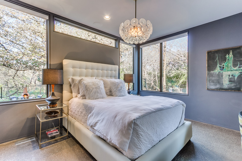 Idées déco pour une chambre parentale contemporaine avec un mur gris et sol en béton ciré.