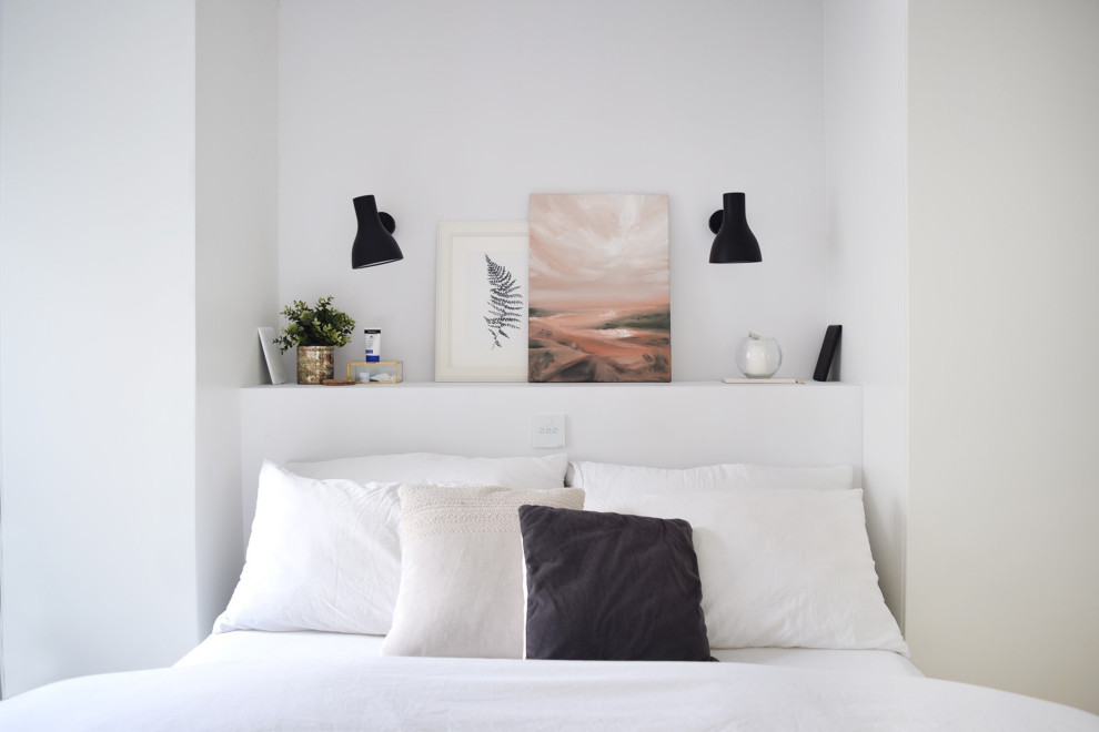 Inspiration for a scandi bedroom in London with white walls.