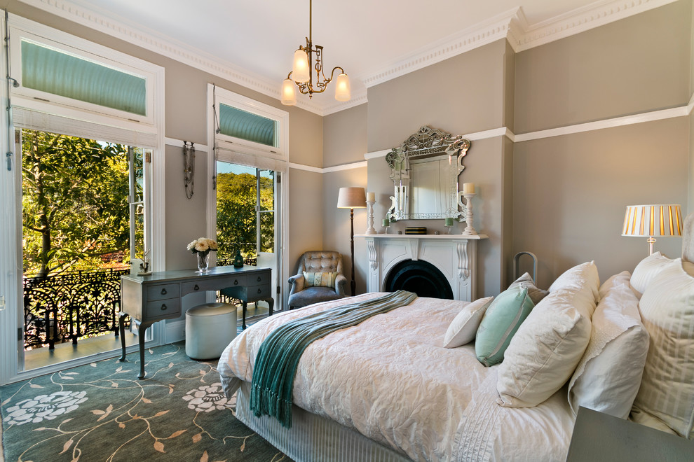 Medium sized classic grey and teal bedroom in Other with brown walls, a standard fireplace, turquoise floors, carpet and a stone fireplace surround.