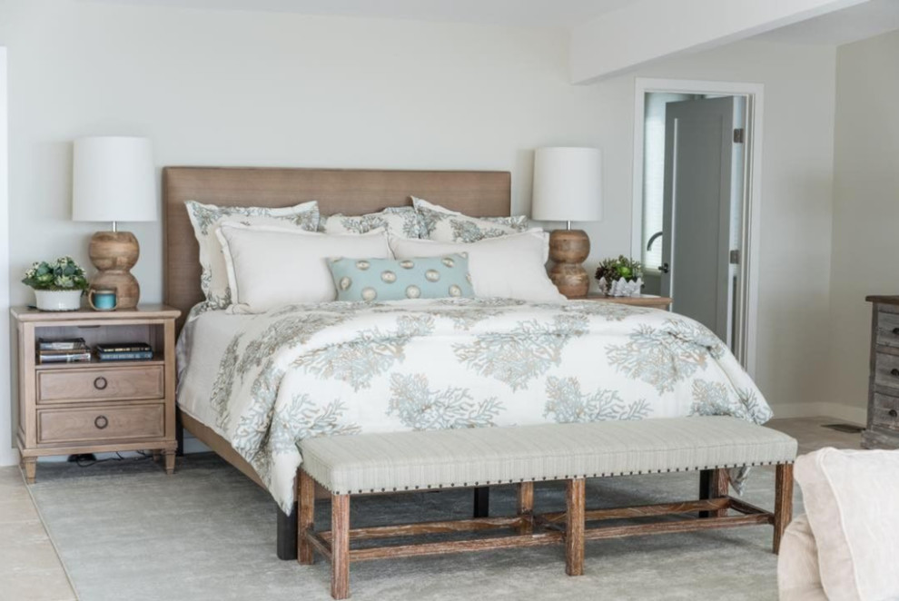 Inspiration for a large coastal master and grey and brown bedroom in Orange County with grey walls, travertine flooring, no fireplace and grey floors.