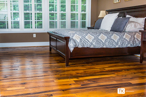 Inspiration for a medium sized contemporary master bedroom in Baltimore with brown walls and medium hardwood flooring.