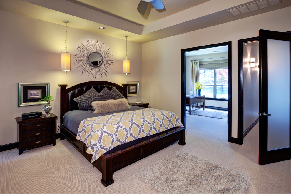 Design ideas for a contemporary bedroom in Oklahoma City with beige walls and carpet.