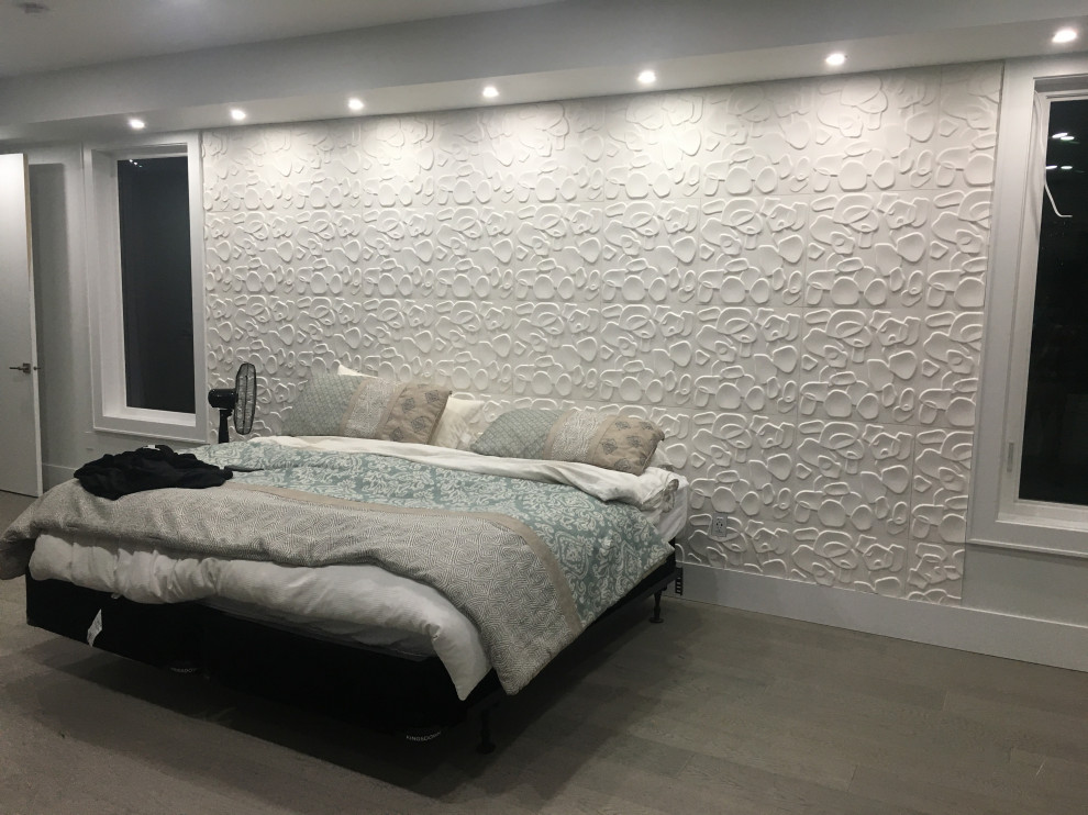 Example of a large trendy master dark wood floor, gray floor and wallpaper bedroom design in Vancouver with white walls and no fireplace