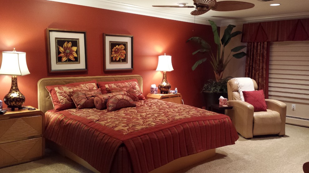 Inspiration for a large contemporary master carpeted bedroom remodel in Newark with orange walls and no fireplace