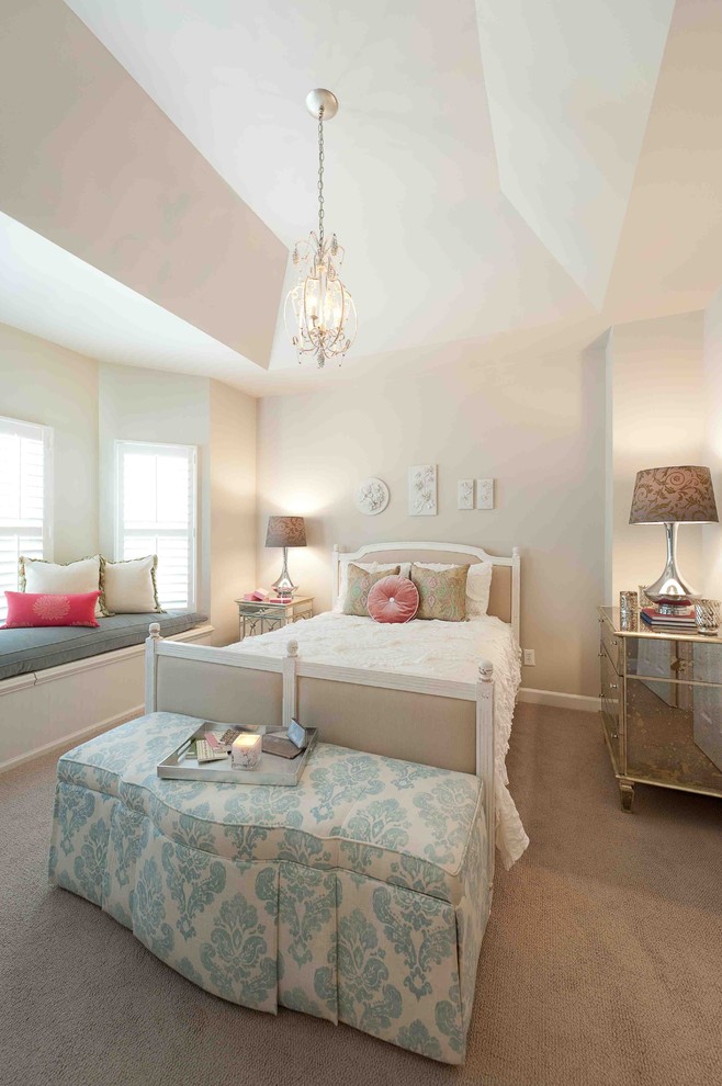 Photo of a contemporary bedroom in DC Metro with beige walls and carpet.