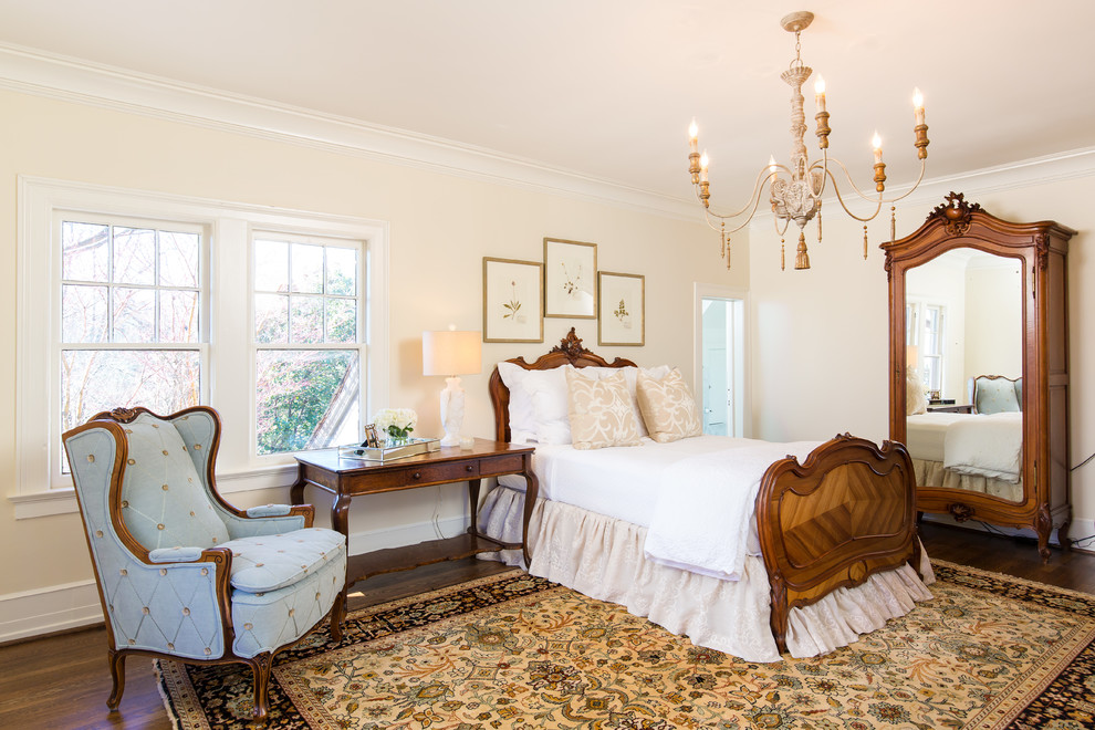 Example of a mid-sized french country guest medium tone wood floor and brown floor bedroom design in Birmingham with beige walls and no fireplace