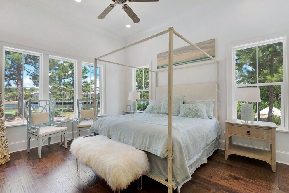 Large transitional master medium tone wood floor bedroom photo in Miami with white walls and no fireplace