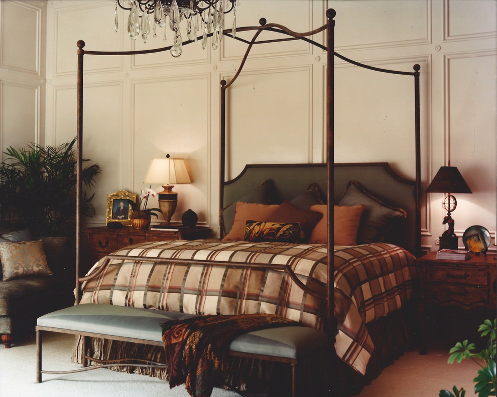 Photo of a large traditional master bedroom in Houston.