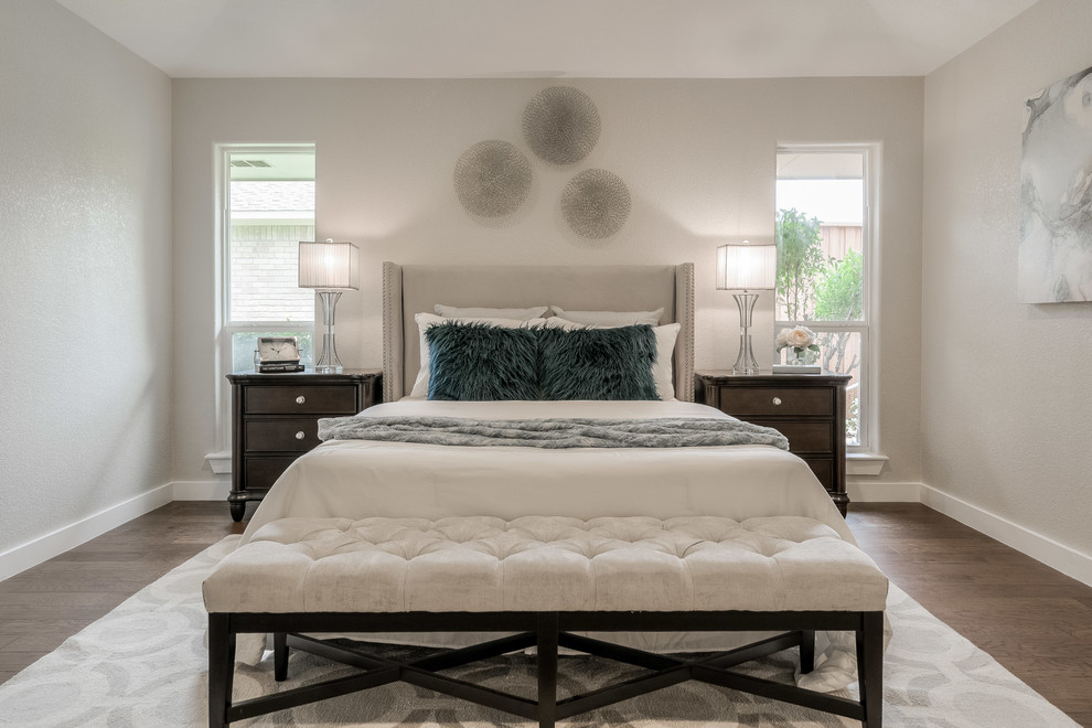 Inspiration for a classic bedroom in Dallas with beige walls, medium hardwood flooring and brown floors.