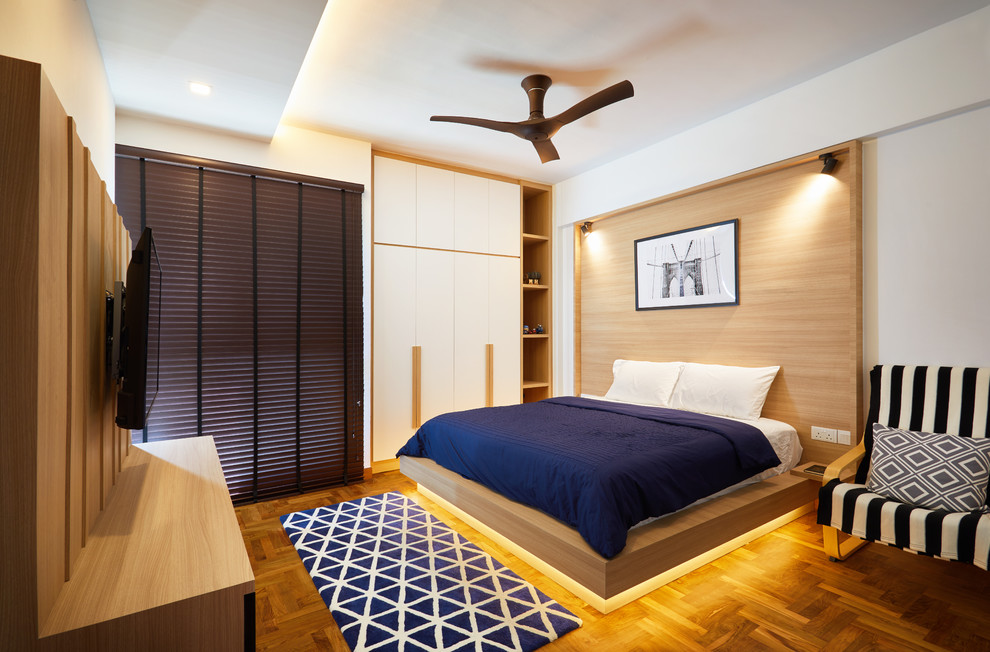 Bedroom - contemporary medium tone wood floor and brown floor bedroom idea in Singapore with white walls