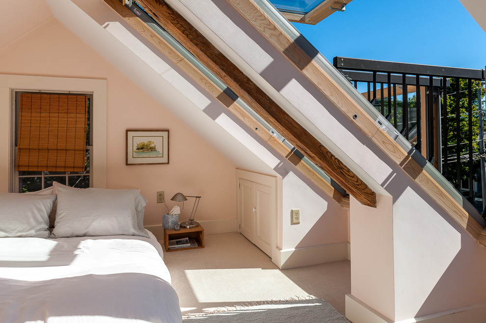 Example of a transitional carpeted bedroom design in Boston with pink walls