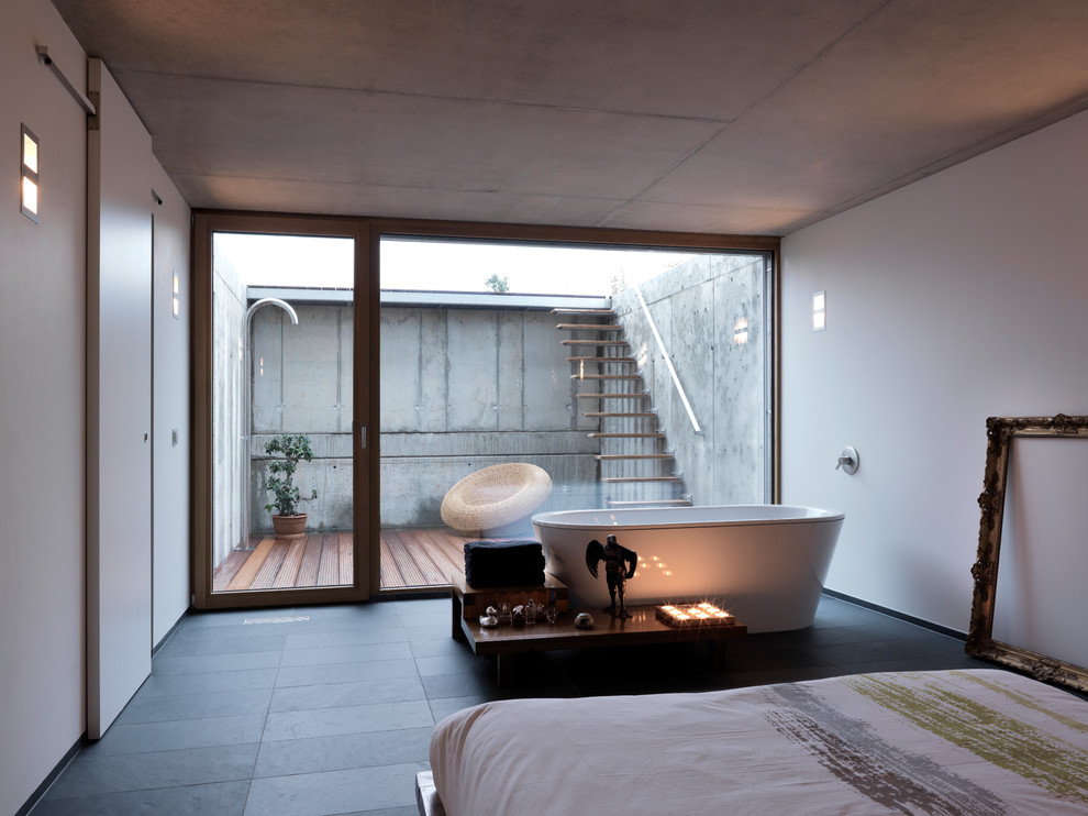 Inspiration for a modern bedroom remodel in Orange County with white walls