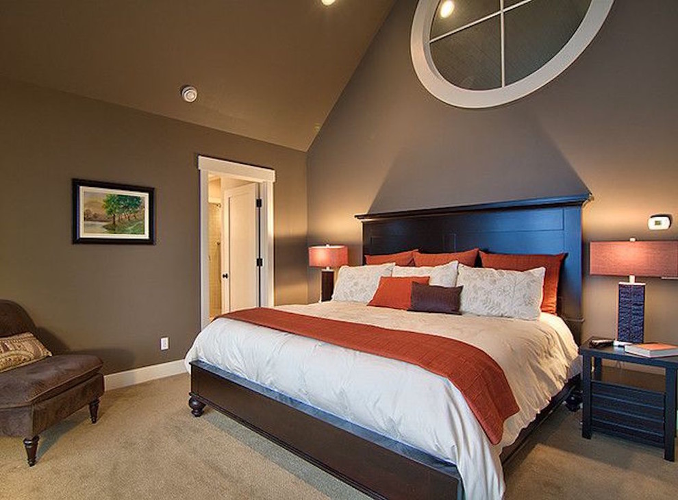 Classic master bedroom in Philadelphia with blue walls, dark hardwood flooring and brown floors.