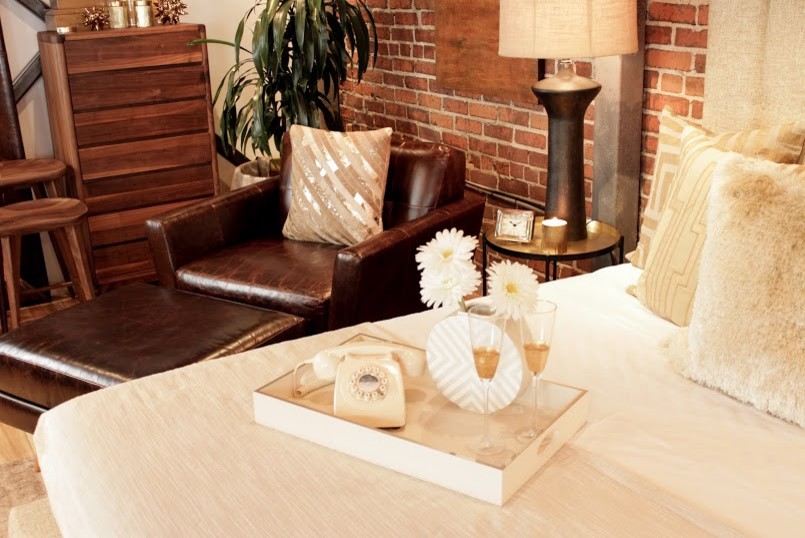 Bedroom - mid-sized modern master light wood floor bedroom idea in Los Angeles with brown walls