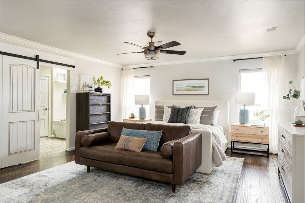 Example of a classic master dark wood floor and brown floor bedroom design in Oklahoma City with gray walls
