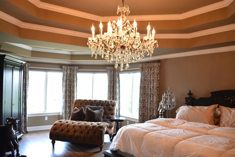 Example of a large transitional master medium tone wood floor bedroom design in Indianapolis with beige walls
