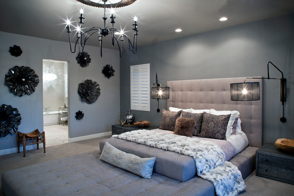 Diseño de dormitorio moderno grande sin chimenea con paredes grises y moqueta