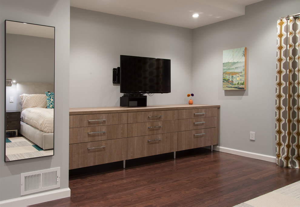 Medium sized modern master bedroom in San Francisco with grey walls, medium hardwood flooring and no fireplace.