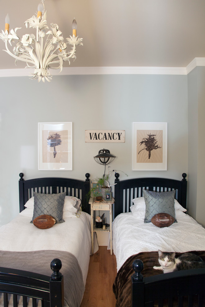 Eclectic bedroom photo in Portland with blue walls