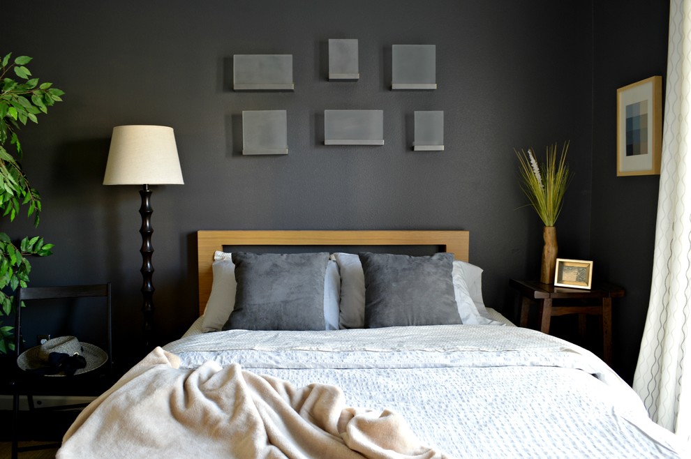 Inspiration pour une chambre d'amis minimaliste de taille moyenne avec un mur gris.