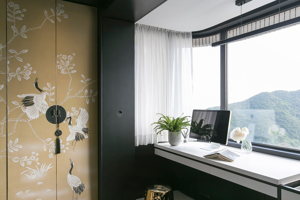 Large world-inspired master bedroom in Hong Kong with black walls, ceramic flooring and yellow floors.