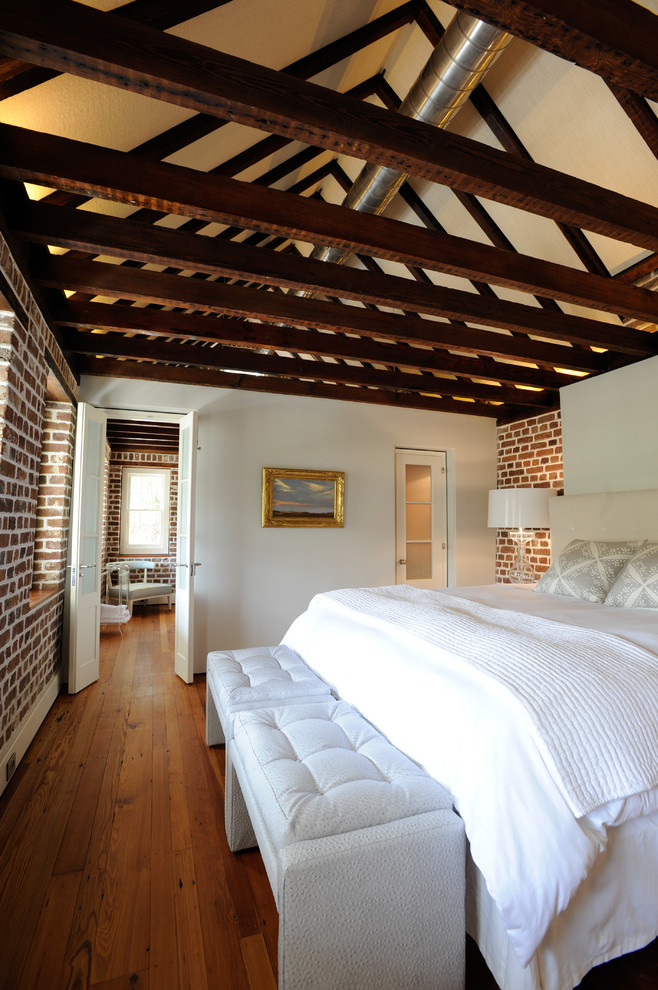 Inspiration for a traditional bedroom in Charleston with white walls.