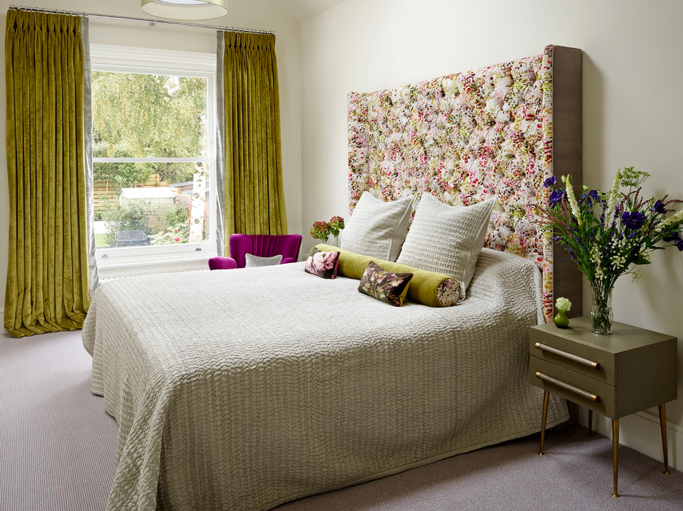 Design ideas for a large classic master bedroom in London with beige walls and carpet.