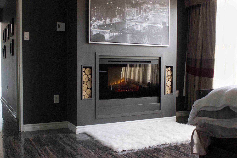 Inspiration for a large contemporary master bedroom in Toronto with grey walls and a plastered fireplace surround.