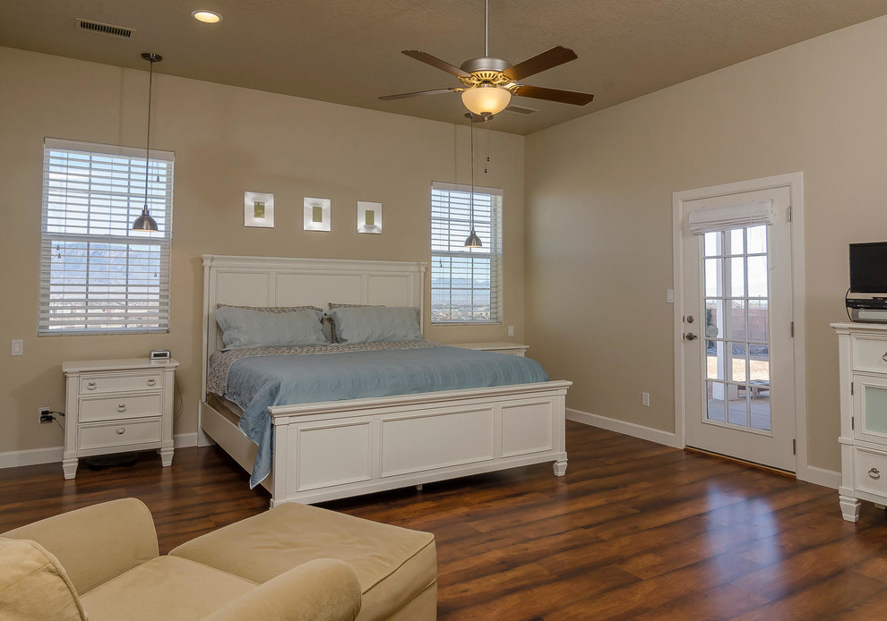 Photo of a medium sized classic master bedroom in Albuquerque with beige walls and dark hardwood flooring.