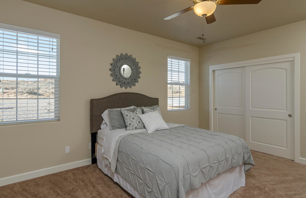 Photo of a medium sized classic master bedroom in Albuquerque with beige walls and carpet.