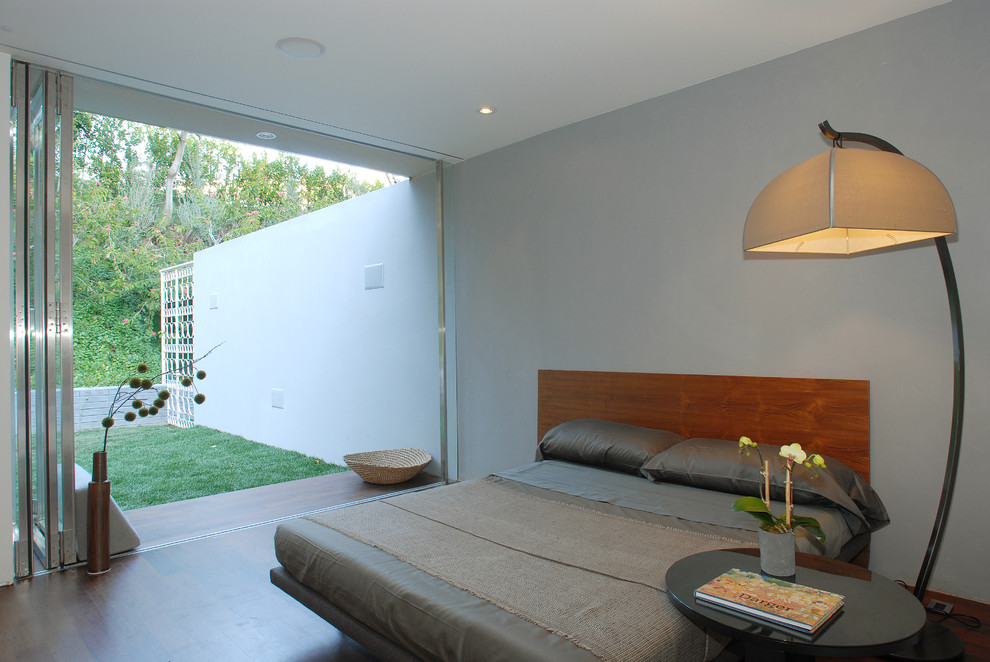 Diseño de dormitorio moderno con paredes grises