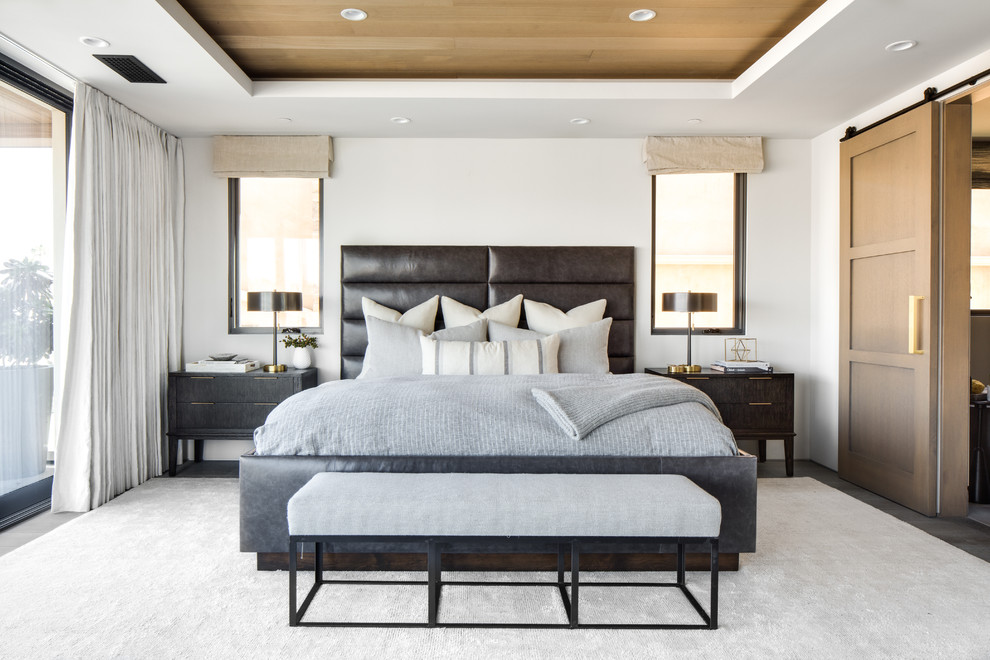 Design ideas for a contemporary master and cream and black bedroom in Orange County with white walls and no fireplace.