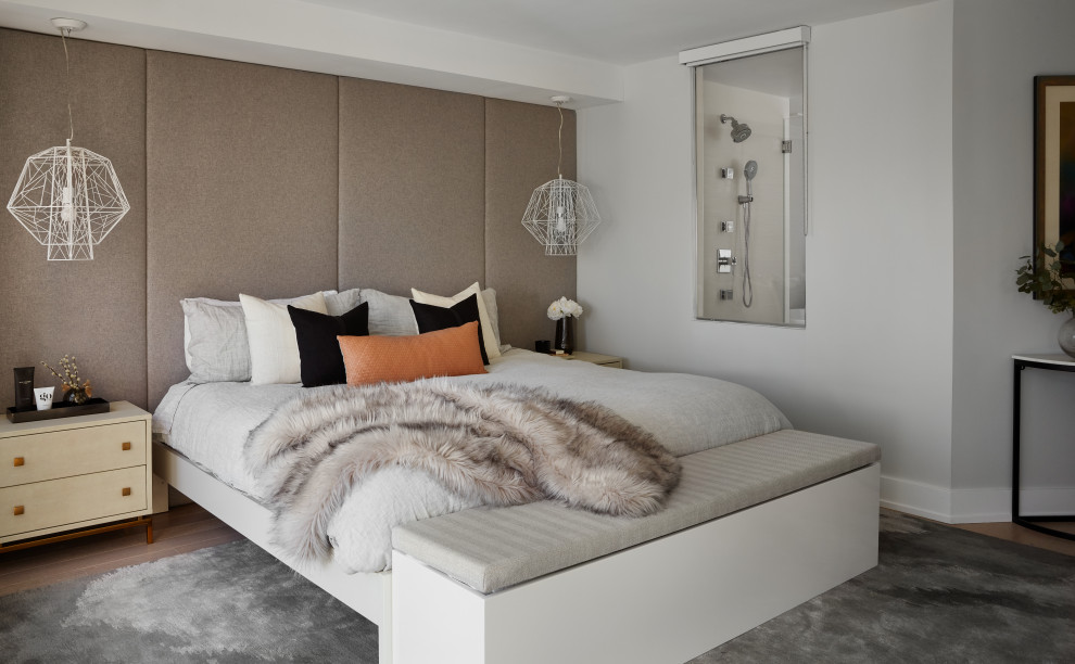 Trendy medium tone wood floor and brown floor bedroom photo in Chicago with gray walls