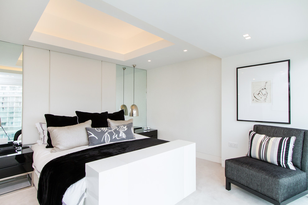 Inspiration for a contemporary carpeted bedroom remodel in London with white walls
