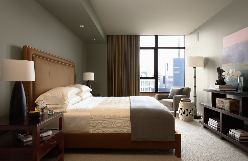 Example of a trendy master carpeted bedroom design in Minneapolis with gray walls and no fireplace