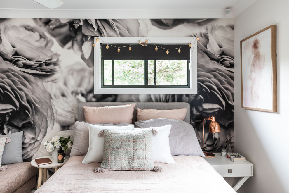 This is an example of a medium sized contemporary guest and grey and pink bedroom in Sydney with carpet, wallpapered walls, white walls and no fireplace.