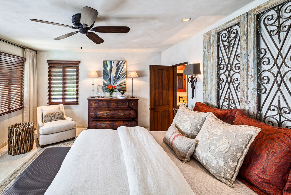 Design ideas for a mediterranean bedroom in Santa Barbara with beige walls and no fireplace.