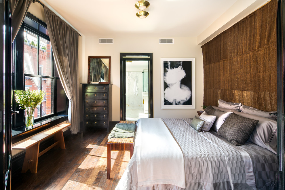 Photo of a contemporary master bedroom in New York with beige walls and dark hardwood flooring.
