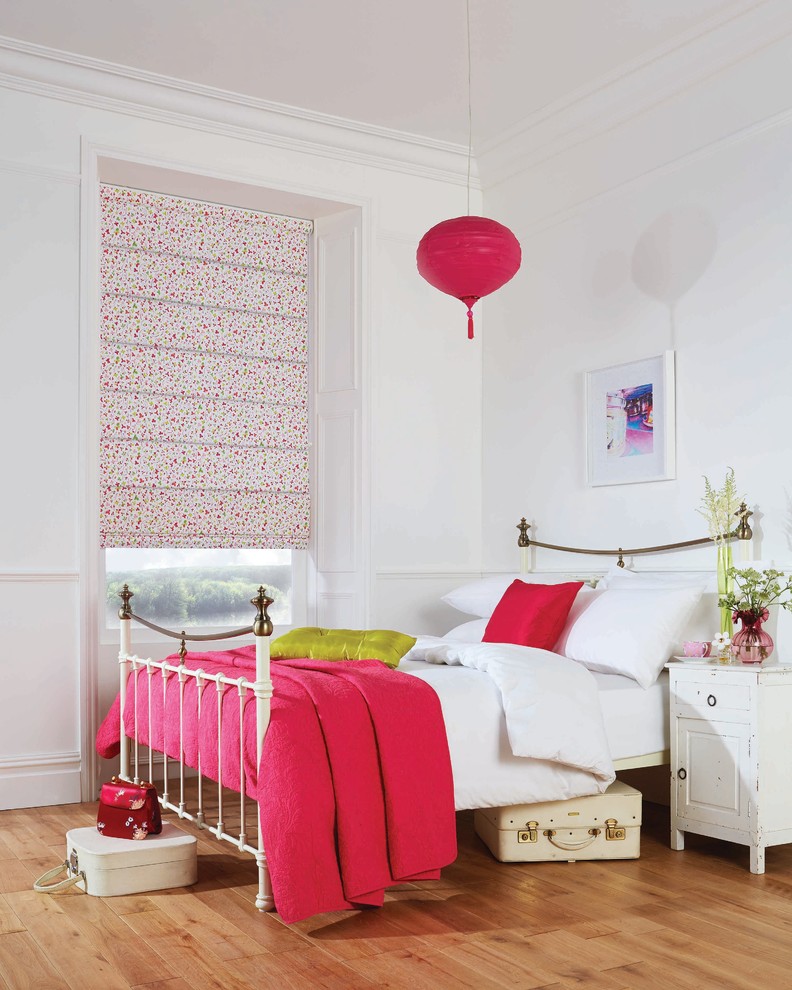 Bedroom - traditional medium tone wood floor bedroom idea in Other with white walls