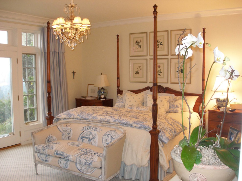 Example of a classic carpeted bedroom design in Portland with beige walls