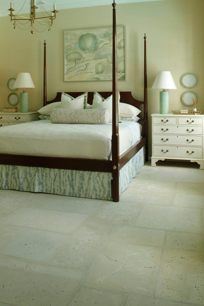 На фото: хозяйская спальня среднего размера с бетонным полом и бежевыми стенами без камина с
