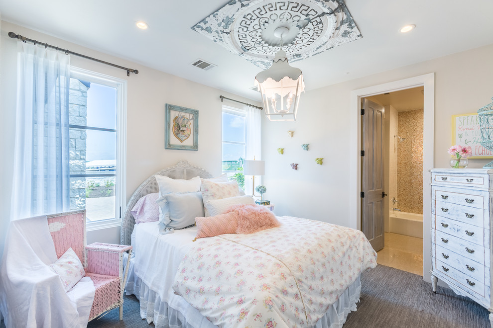 Shabby-chic style grey and pink bedroom in Austin with beige walls, carpet and grey floors.