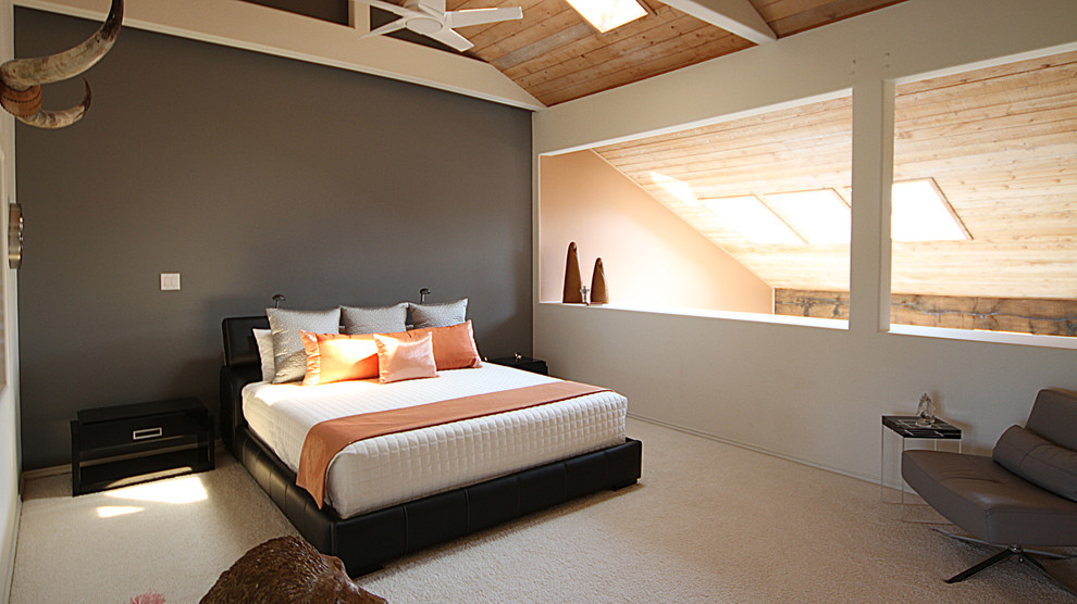 Example of a large minimalist loft-style carpeted bedroom design in Dallas with beige walls and no fireplace