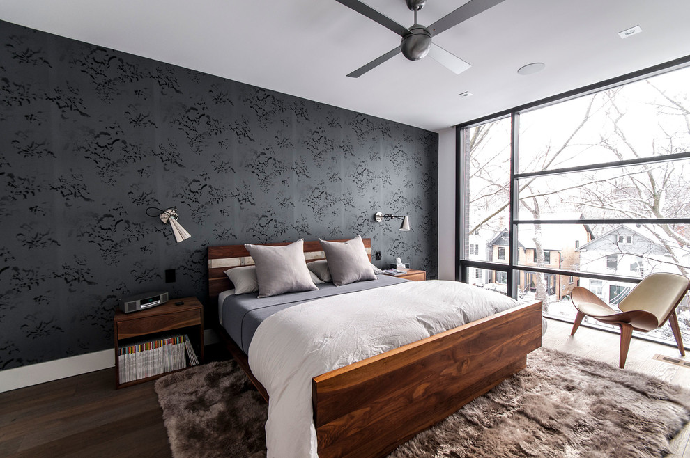 Inspiration for a modern master bedroom remodel in Toronto with black walls