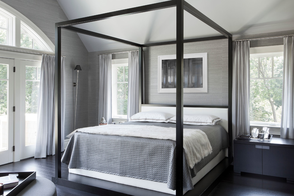 Example of a transitional dark wood floor bedroom design in New York with gray walls