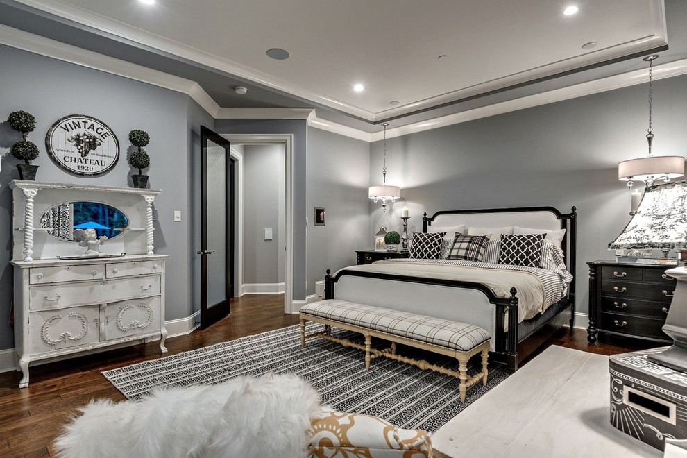 Medium sized classic guest bedroom in New York with grey walls, medium hardwood flooring and brown floors.