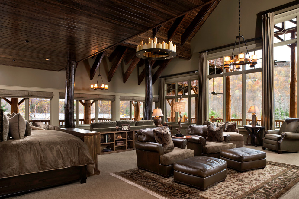 This is an example of an expansive rustic master bedroom in Other with green walls and carpet.