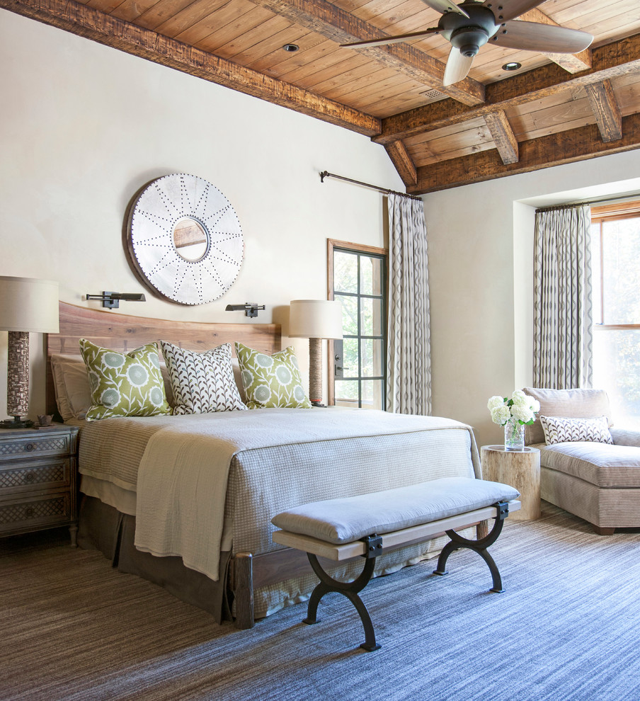 Design ideas for a rustic master bedroom in Other with white walls and feature lighting.